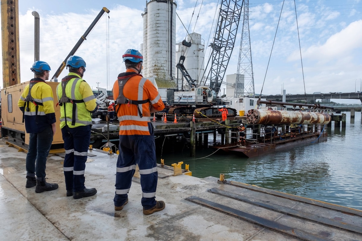 A 19.5 tonne TBM was lifted out of the Onehunga Wharf after successfully tunnelling the Clarks Beach Outfall. Image: Watercare