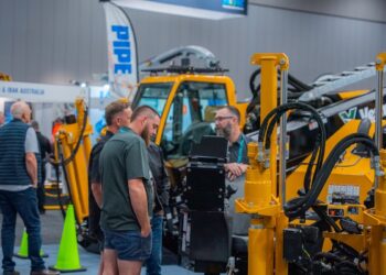 Attendees at No-Dig Down Under inspect drill rigs.