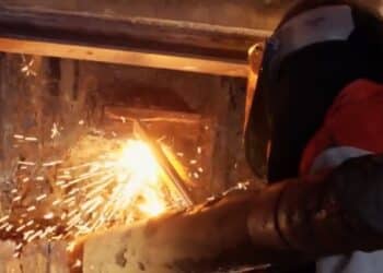 A worker drills under Swanson Dock as part of microtunnelling works.