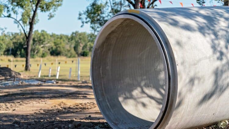 Large concrete culvert to be installed from one side of the road to the other.