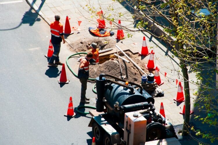Council workers perform vacuum extraction in Brisbane.